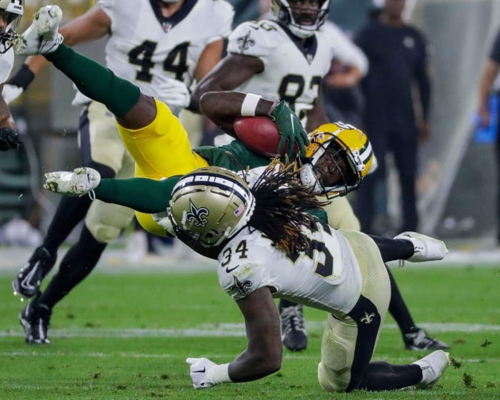Green Bay Packers receiver Amari Rodgers is upended by New Orleans Saints running back Tony Jones Jr. (34) on a punt return. Tork Mason / USA TODAY NETWORK